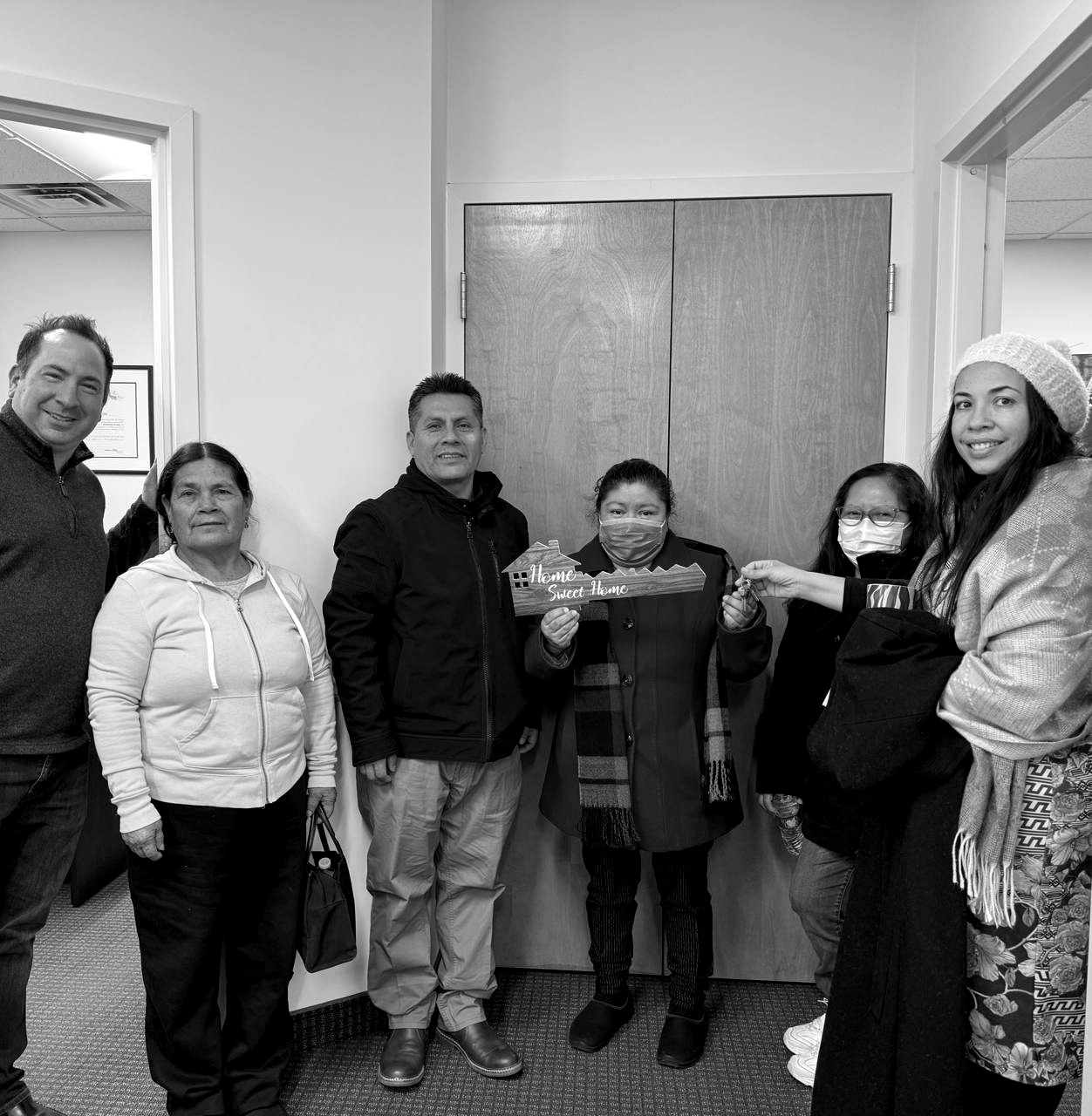 Basilia Azcona with clients at closing